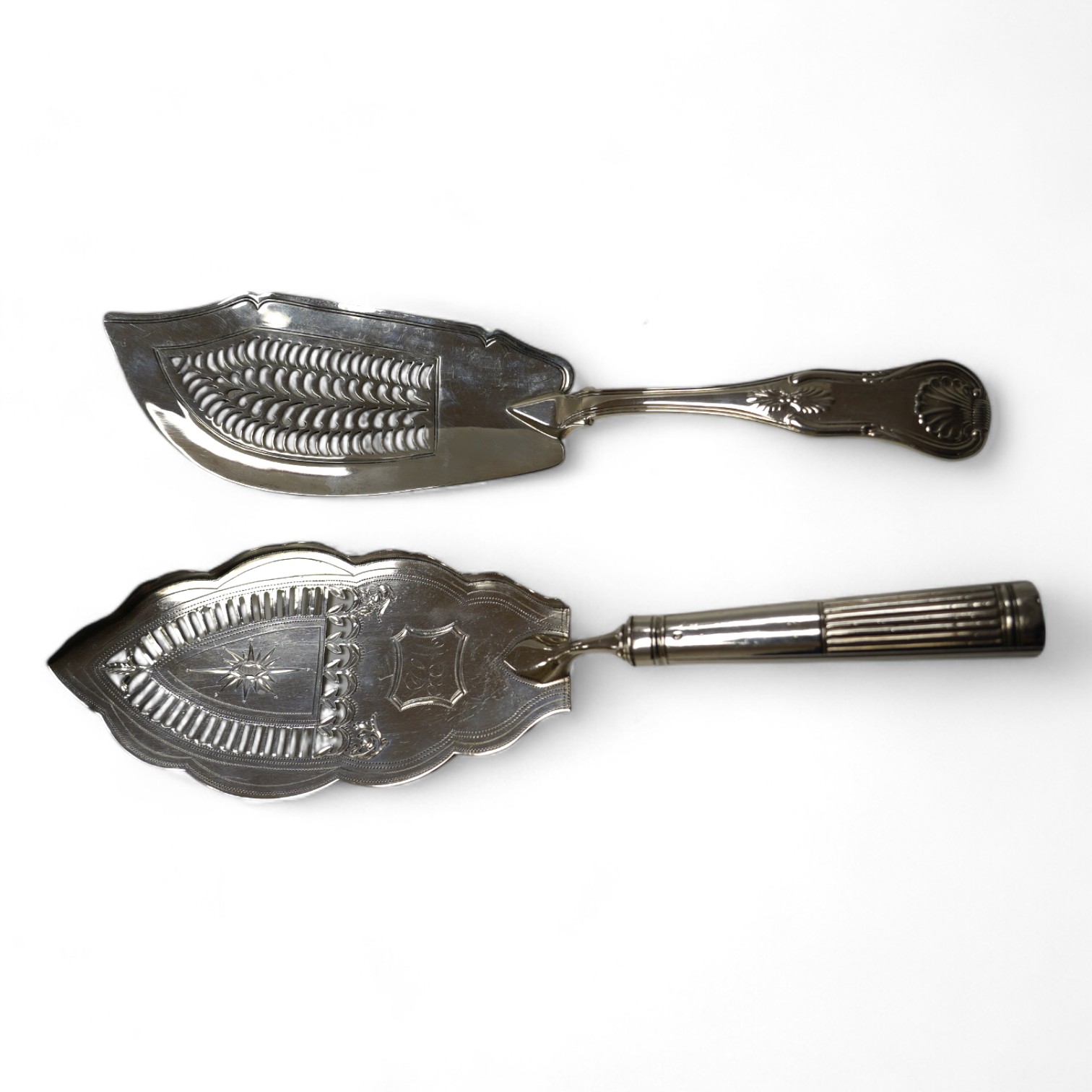 A George III silver fish slice with part gallery border, Henry Chawner, London, 1791, 30.4cm and a later George IV silver King's pattern fish slice, London, 1821. Condition - poor to fair